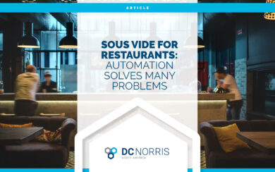 an image of a restaurant interior at dusk with large black pendant lights hanging above a modern bar. Headline on the page reads 'Sous Vide for Restaurants: Automation Solves Many Problems" and is above the DC Norris North America logo