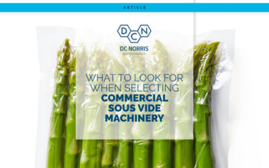 bright green, fresh asparagus sealed in a vacuum pouch on a white background behind a headline that reads: What to Look for When Selecting Commercial Sous Vide Machinery. The headline appears below the DC Norris North America logo